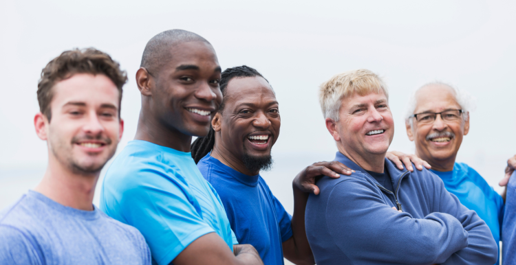 men smiling, wearing blue