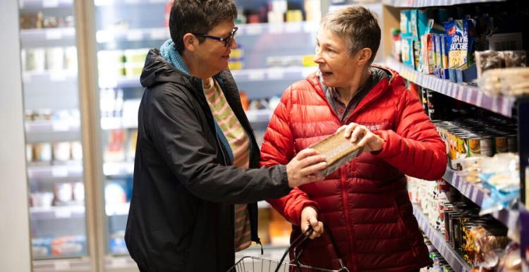 2 women shopping for food