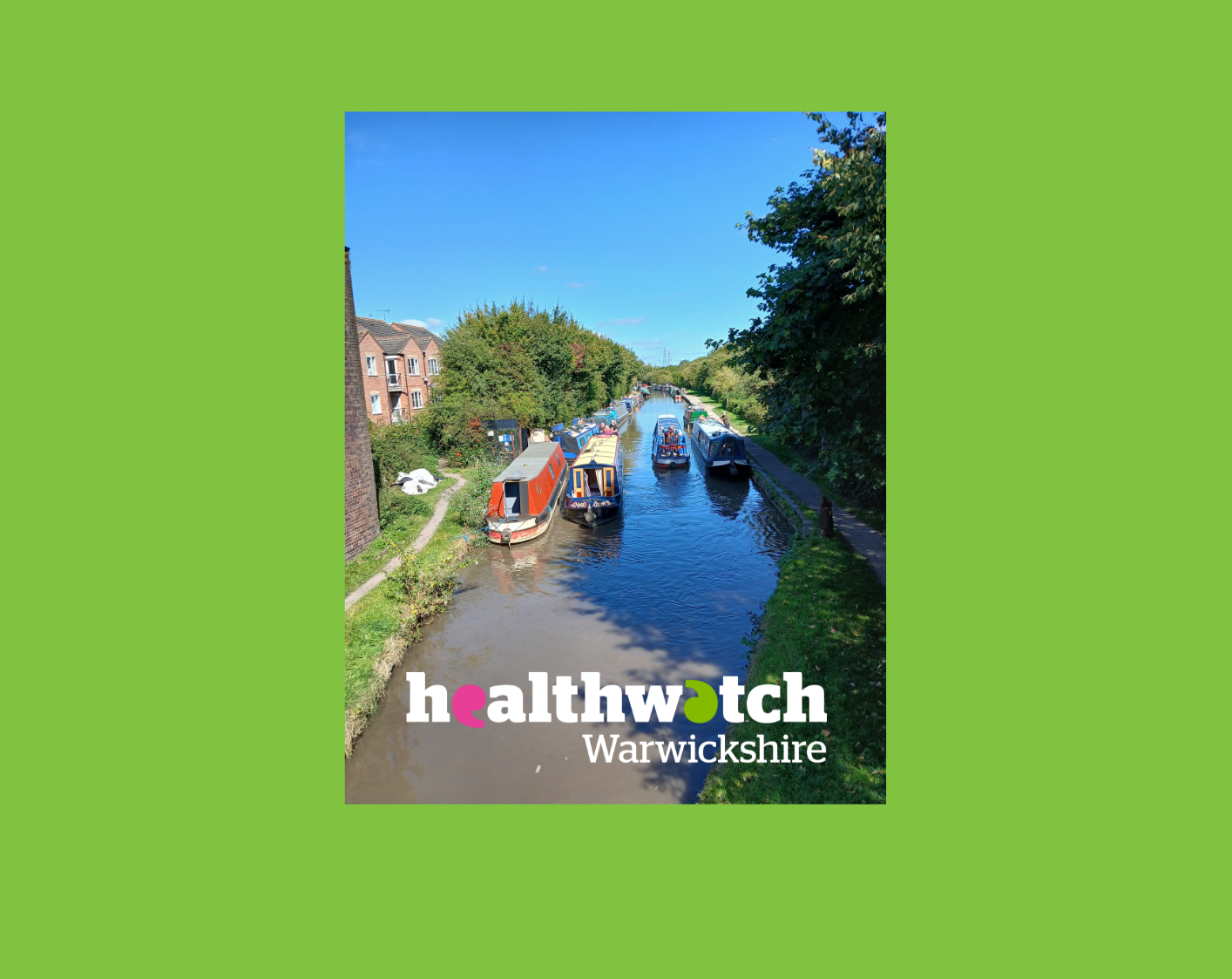 Canal boats, blue sky and trees