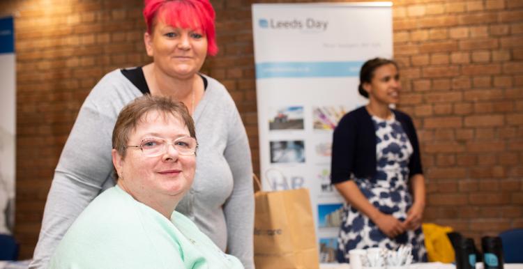 2 ladies attending a community event