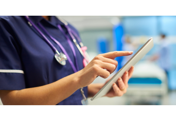 NHS staff with a digital tablet