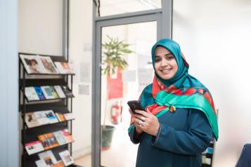 a lady holding a smartphone