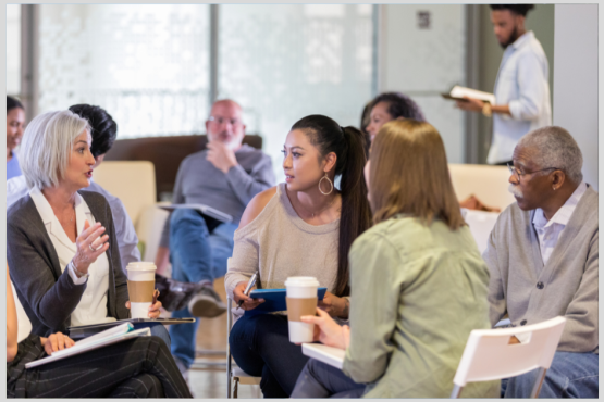 Group of men and women talking