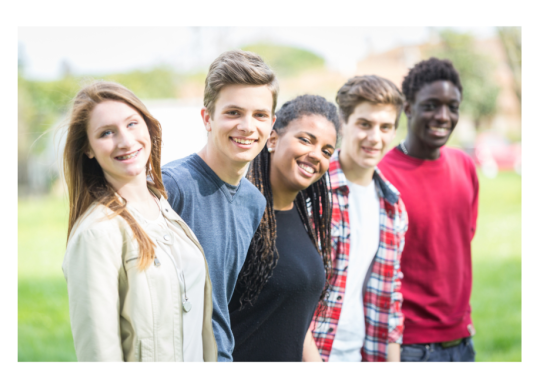 Group of five young people outside